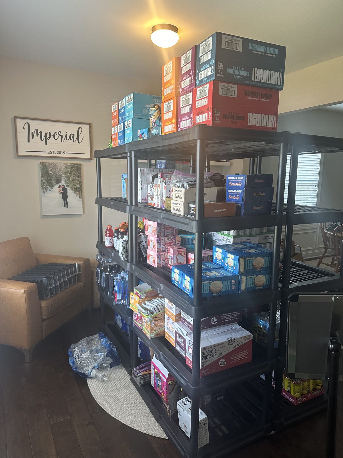 The home warehouse — stocked shelving racks in the living room